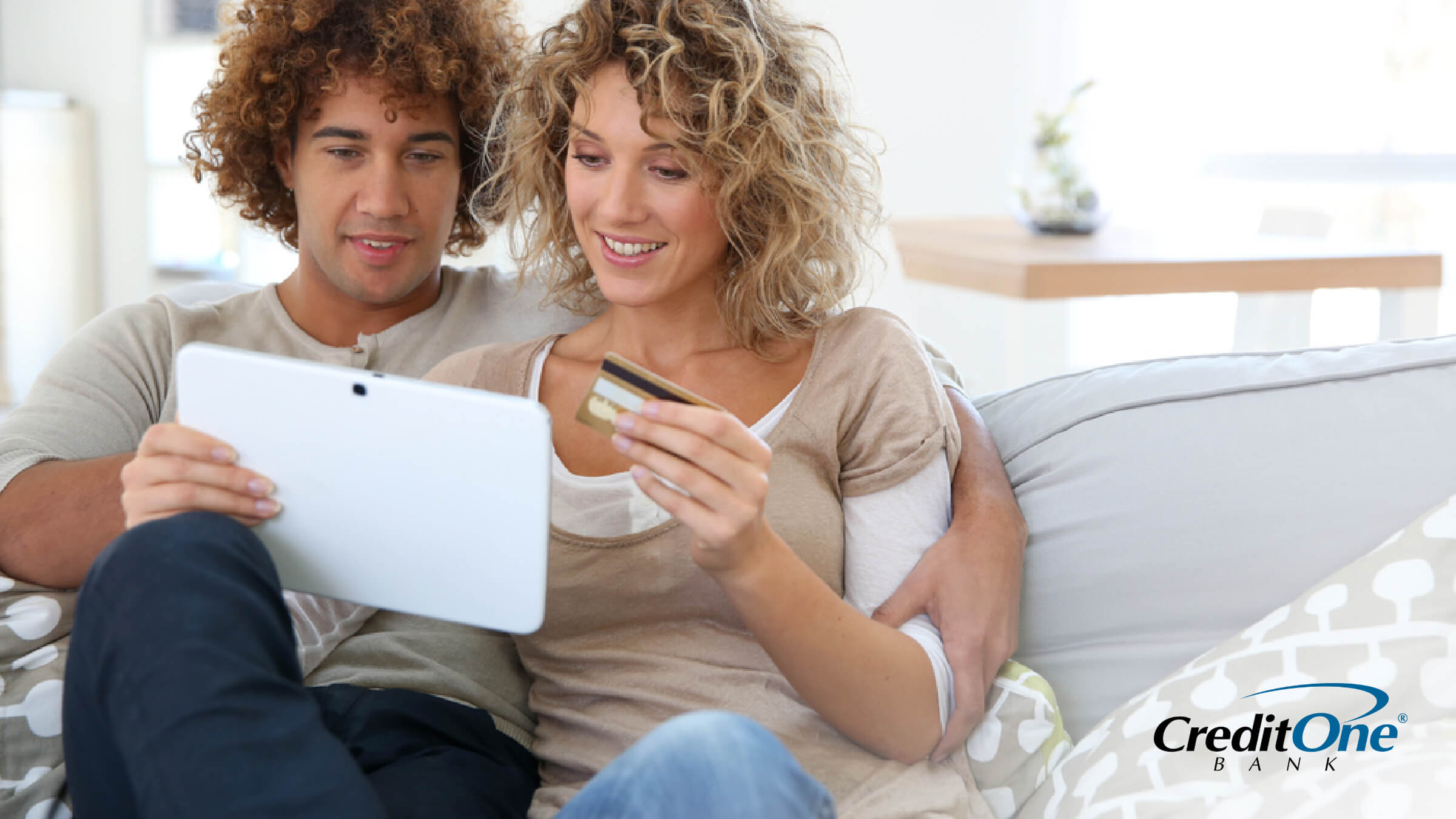 A couple reviewing the benefits of having a secured credit card.